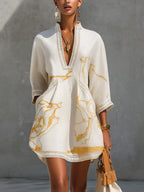 Aliénor | Vestido mini de encaje crochet marfil con motivos dorados